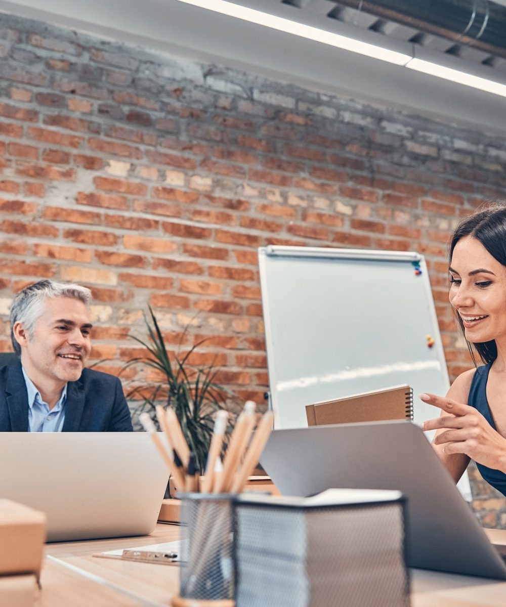 portrait-of-architect-having-discussion-in-office.jpg